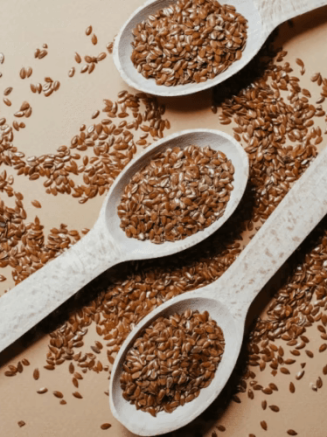 Flax Seeds (Flaxseeds) in Spoon and table