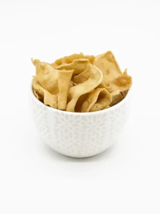 Black Pepper Papdi – Authentic Indian Snacks by Chandra Foods – In a white ceramic bowl Black Pepper Papdi - Authentic Indian Snacks by Chandra Foods - In a white ceramic bowl